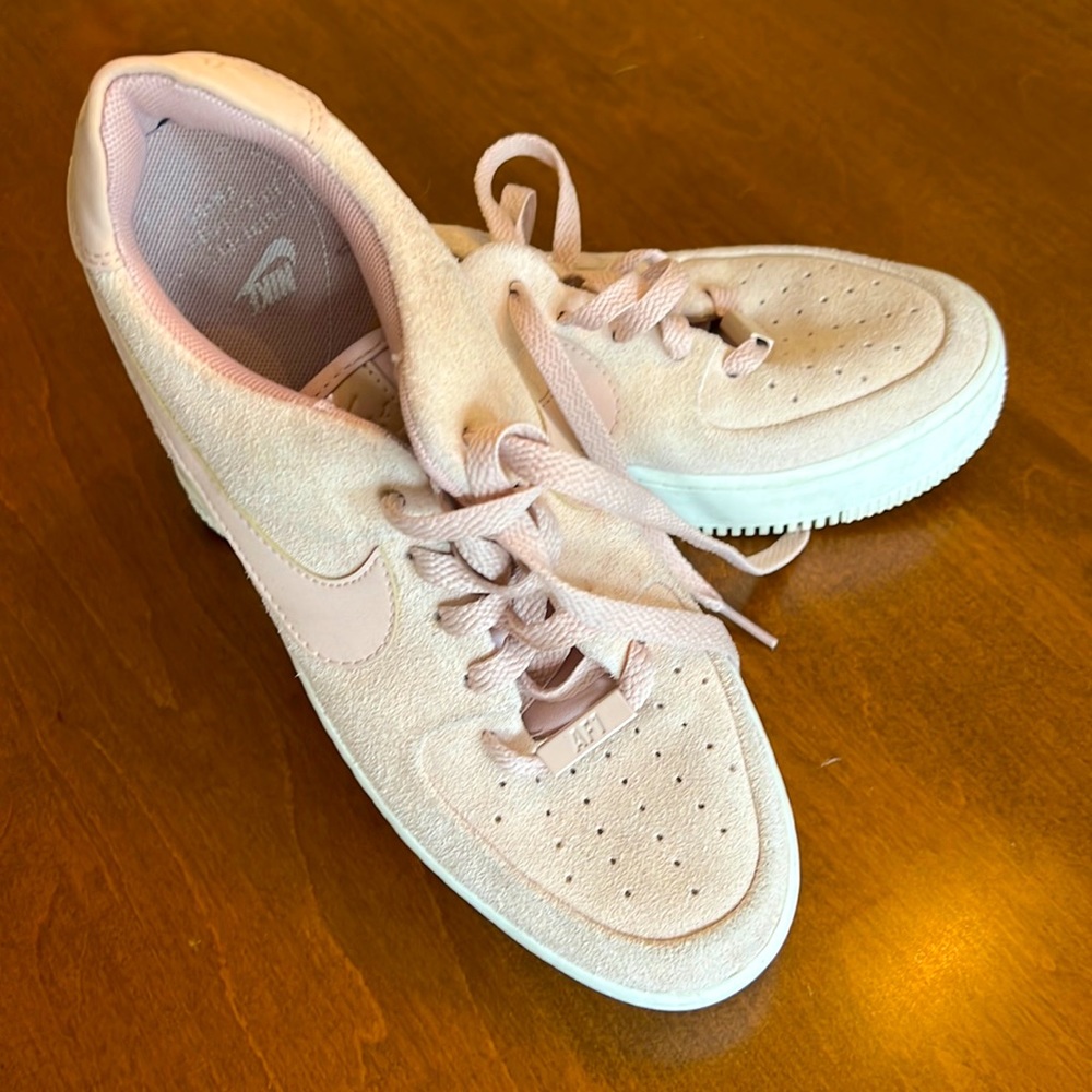 Pink suede Nike Air Force 1 shoes